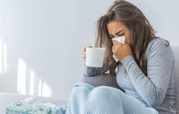 Image of a woman suffering from flu