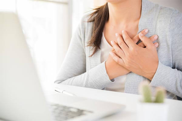 Image of a woman experiencing breast pain